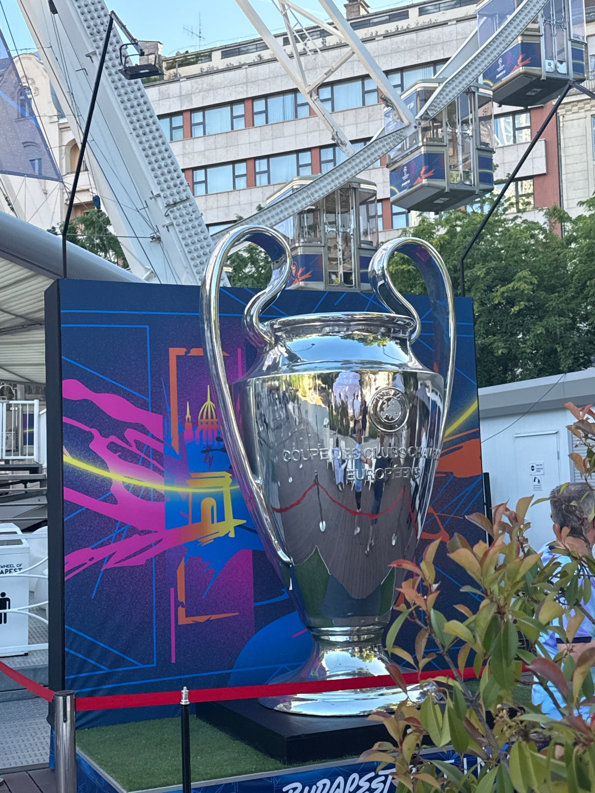 Champions League trophy display draws crowds near Budapest ferris wheel