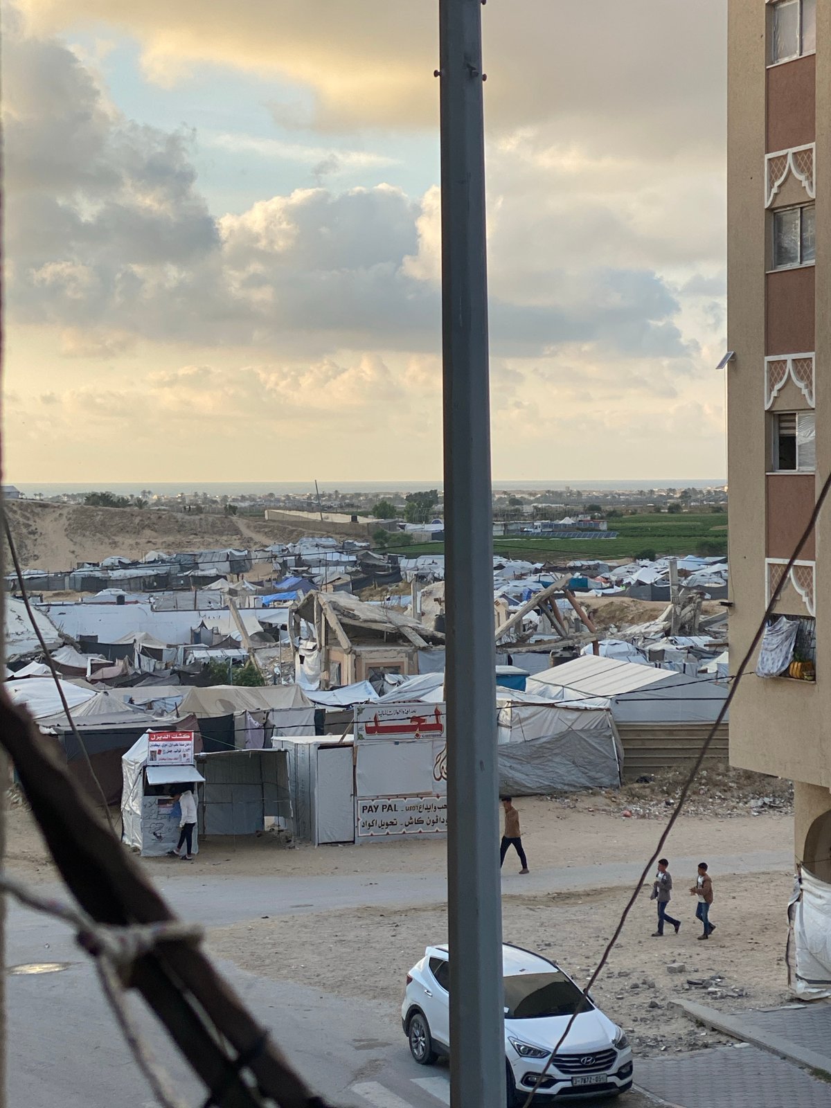 Daily life documented amid damaged buildings, tent settlements in Khan Yunis