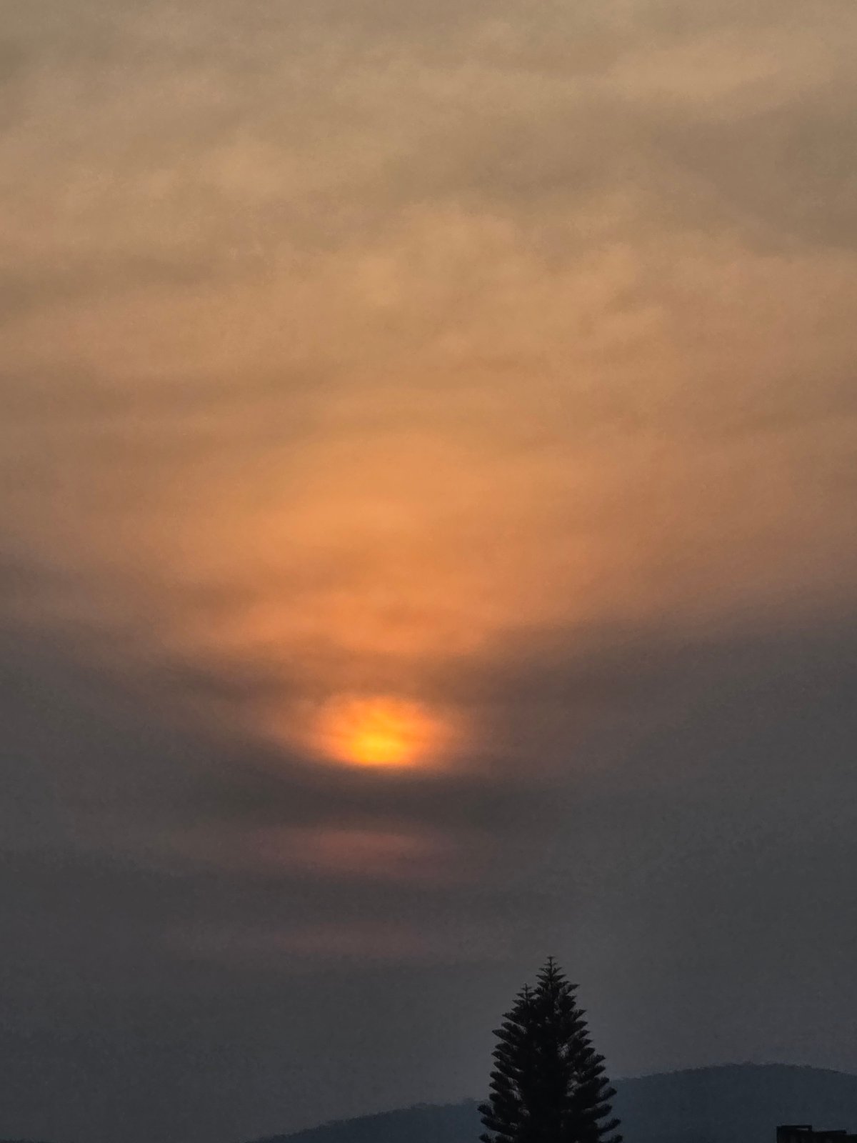 Thick orange haze obscures sky in Amayuca, Mexico