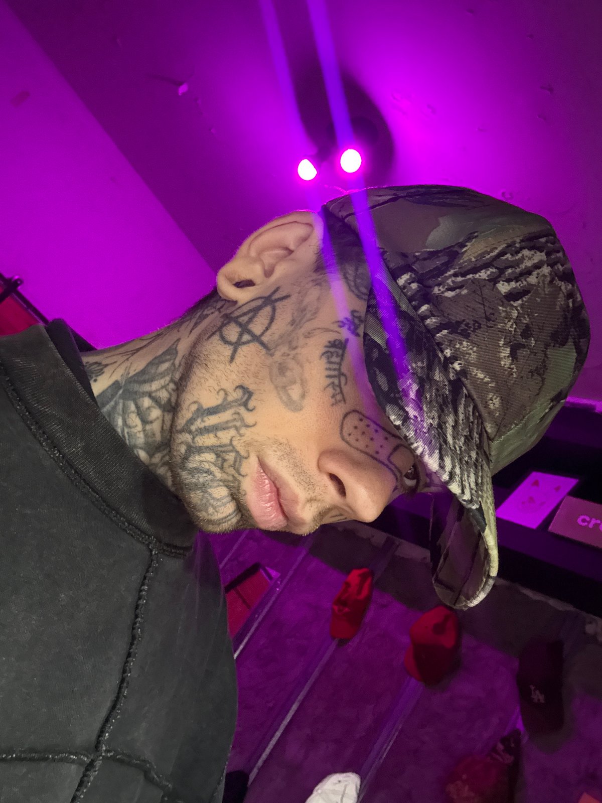 Close-up portraits of a heavily tattooed figure in Buenos Aires