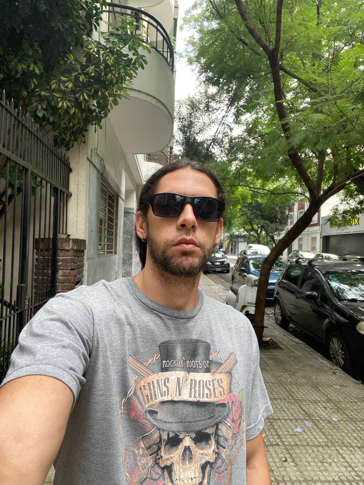 Tourist takes selfie on Buenos Aires sidewalk