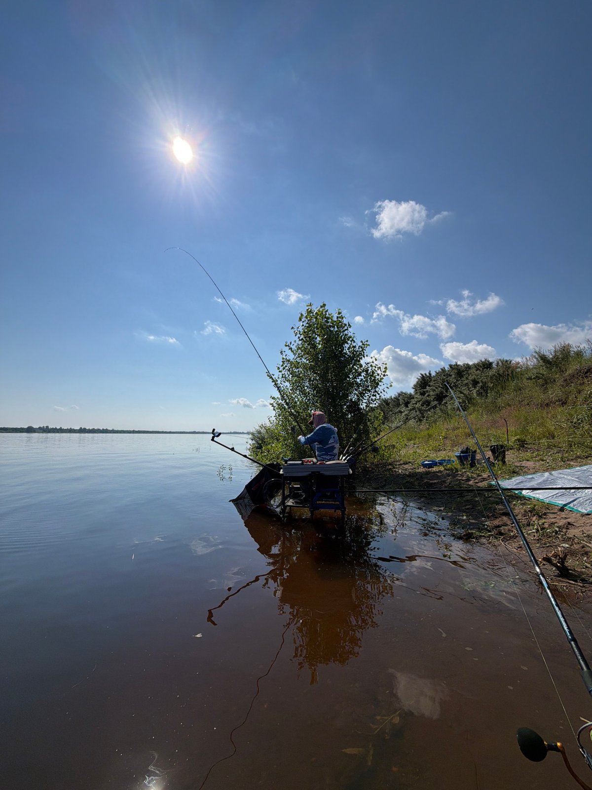 Riverside fishing session near Tarasovo on a calm summer morning