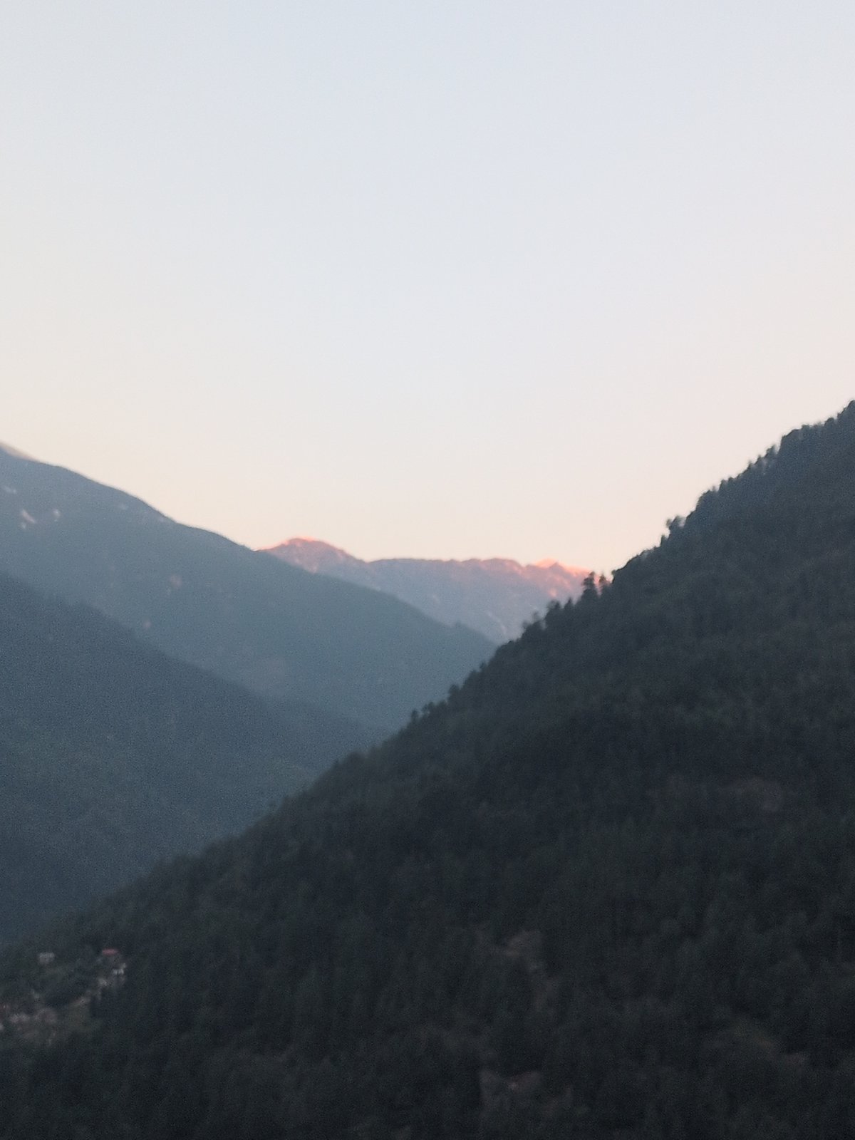 Dawn breaks over Himalayan peaks in Vashisht, India