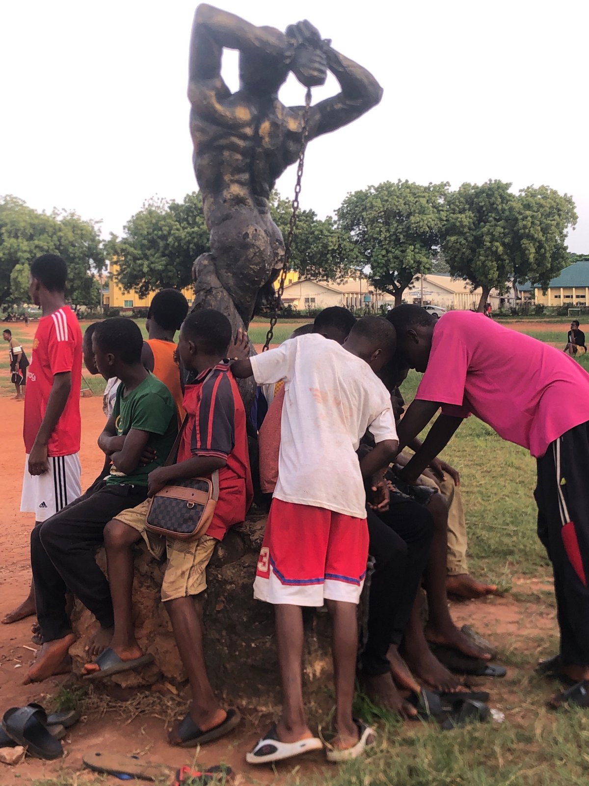 Young men play informal soccer in Nsugbe, Nigeria