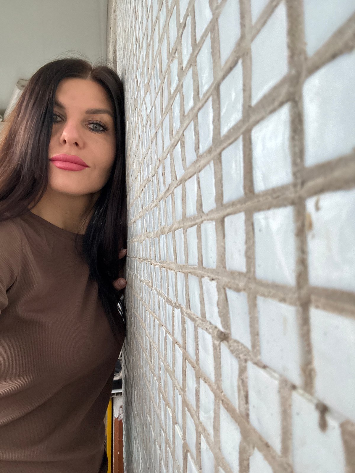 Woman photographed in multiple indoor settings in Chaikovsky