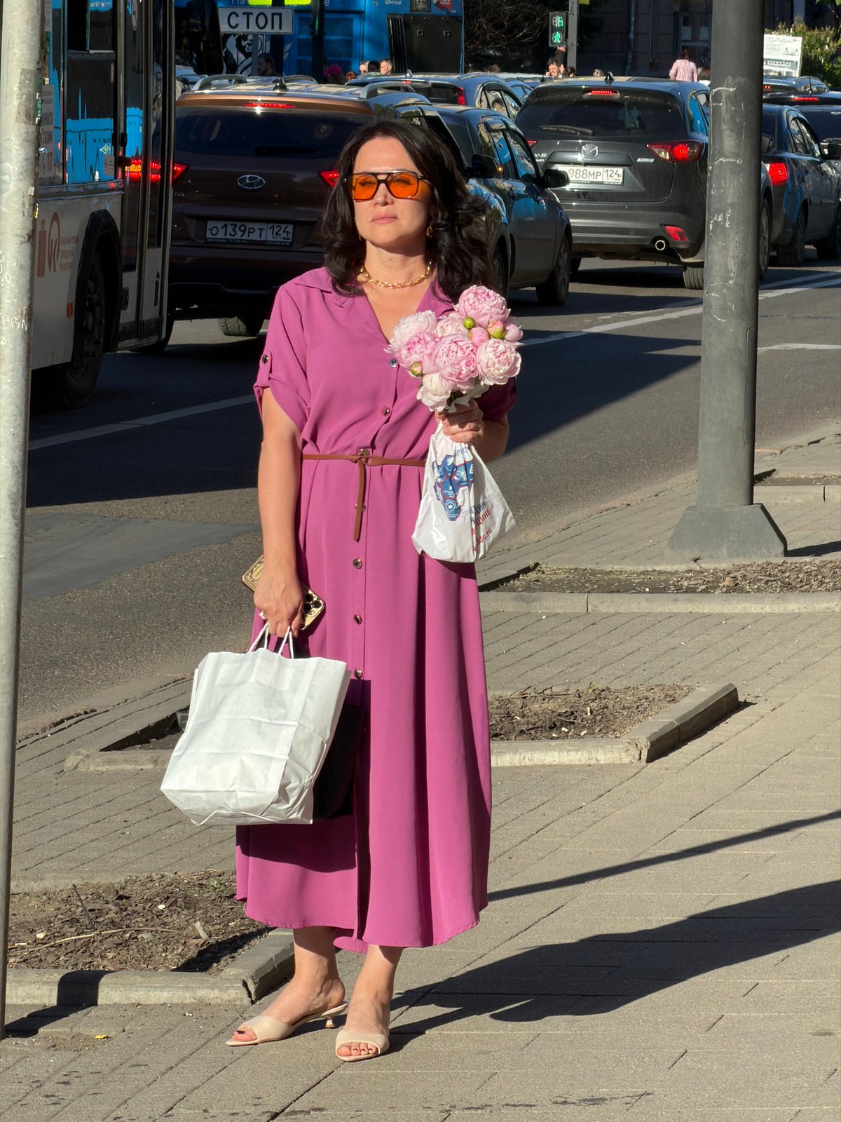 Summer morning foot traffic on Krasnoyarsk's city sidewalks