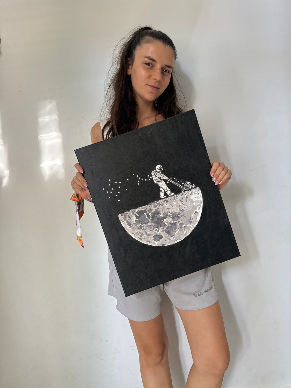 Woman displays moon mining artwork in Mũi Né Vietnam