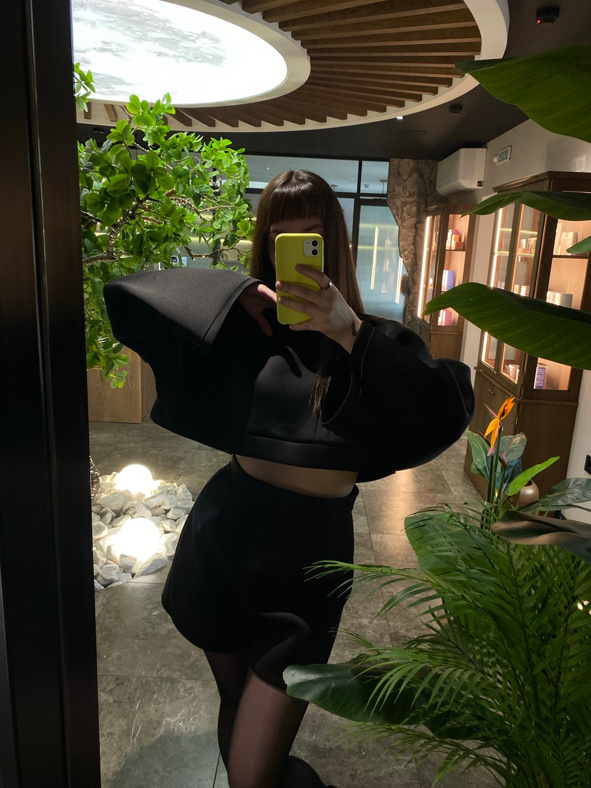 Woman takes morning selfies in decorated Votkinsk interior