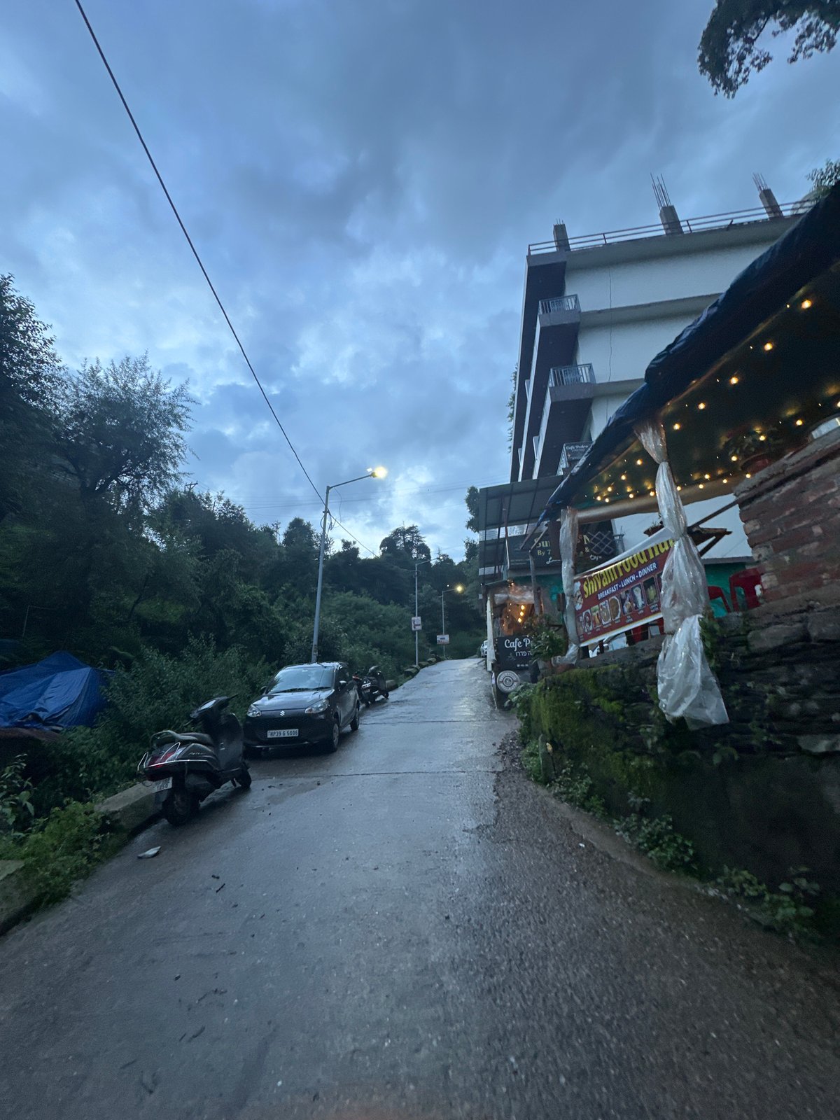 Group outing on a rainy Himalayan hillside trail
