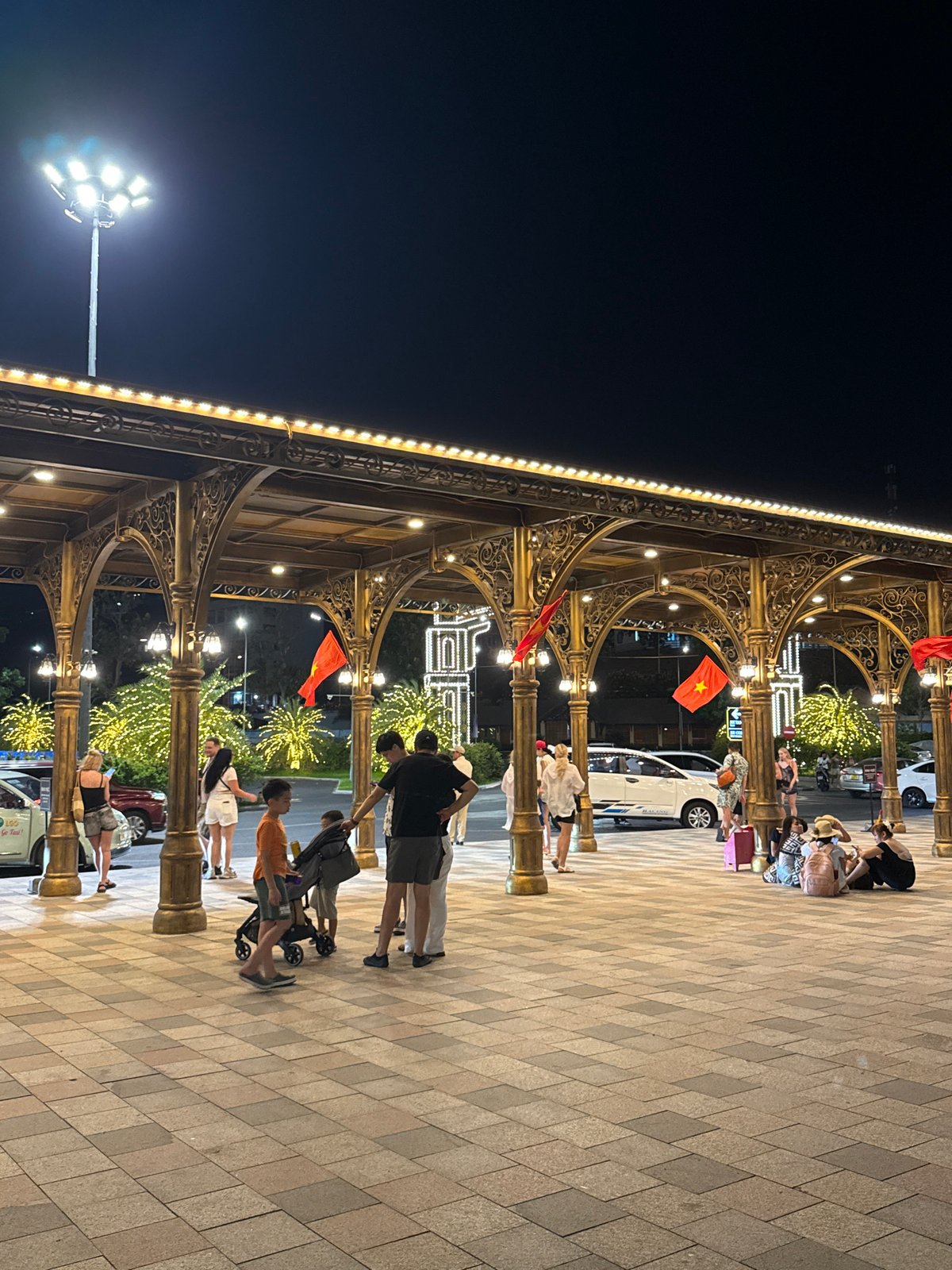 Night scene captured at illuminated arcade in Nha Trang