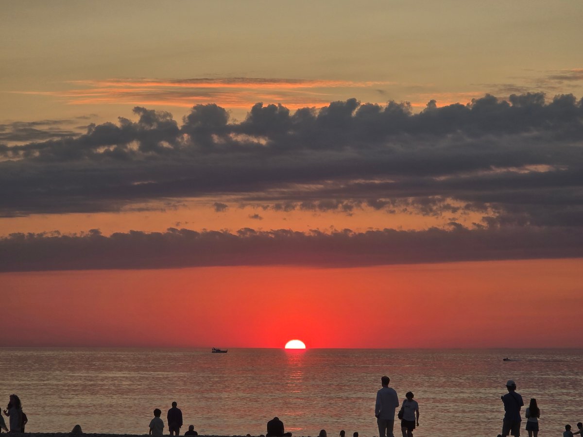 Sunset on a pebble beach near a Marriott resort