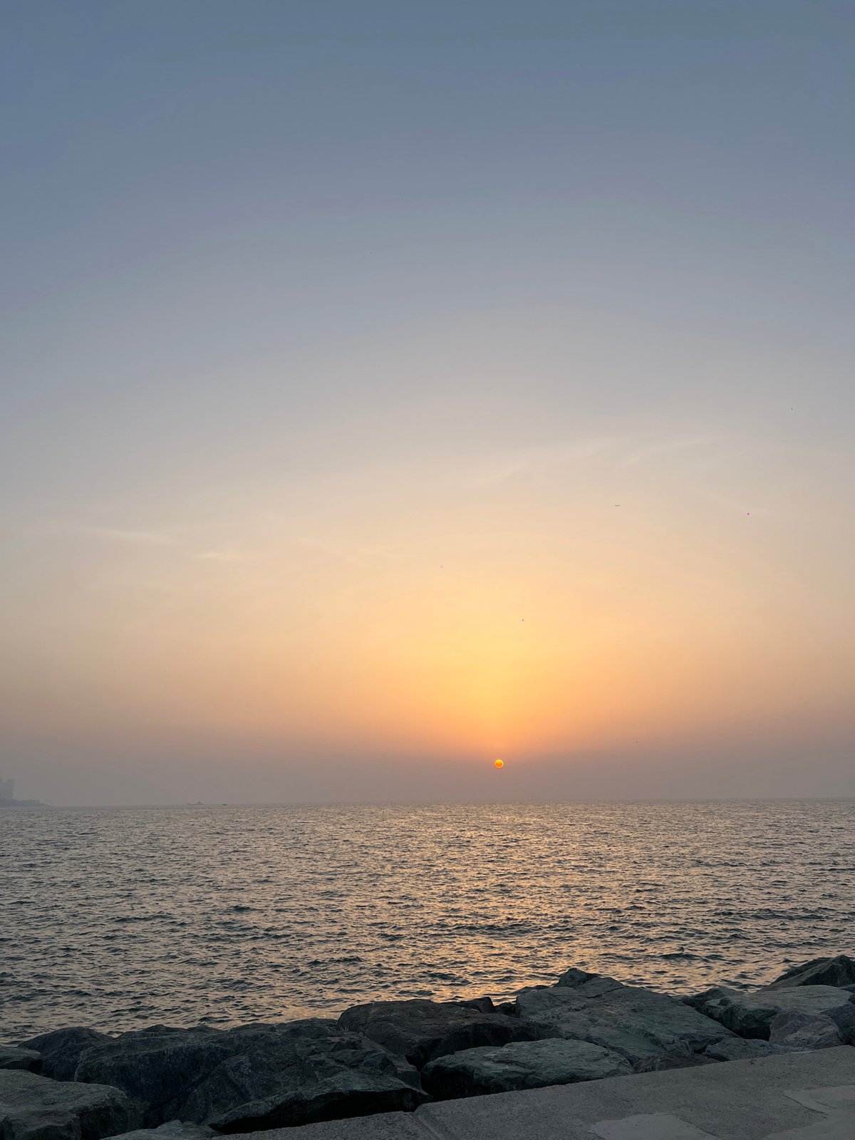Hazy sunset observed over Dubai coastline