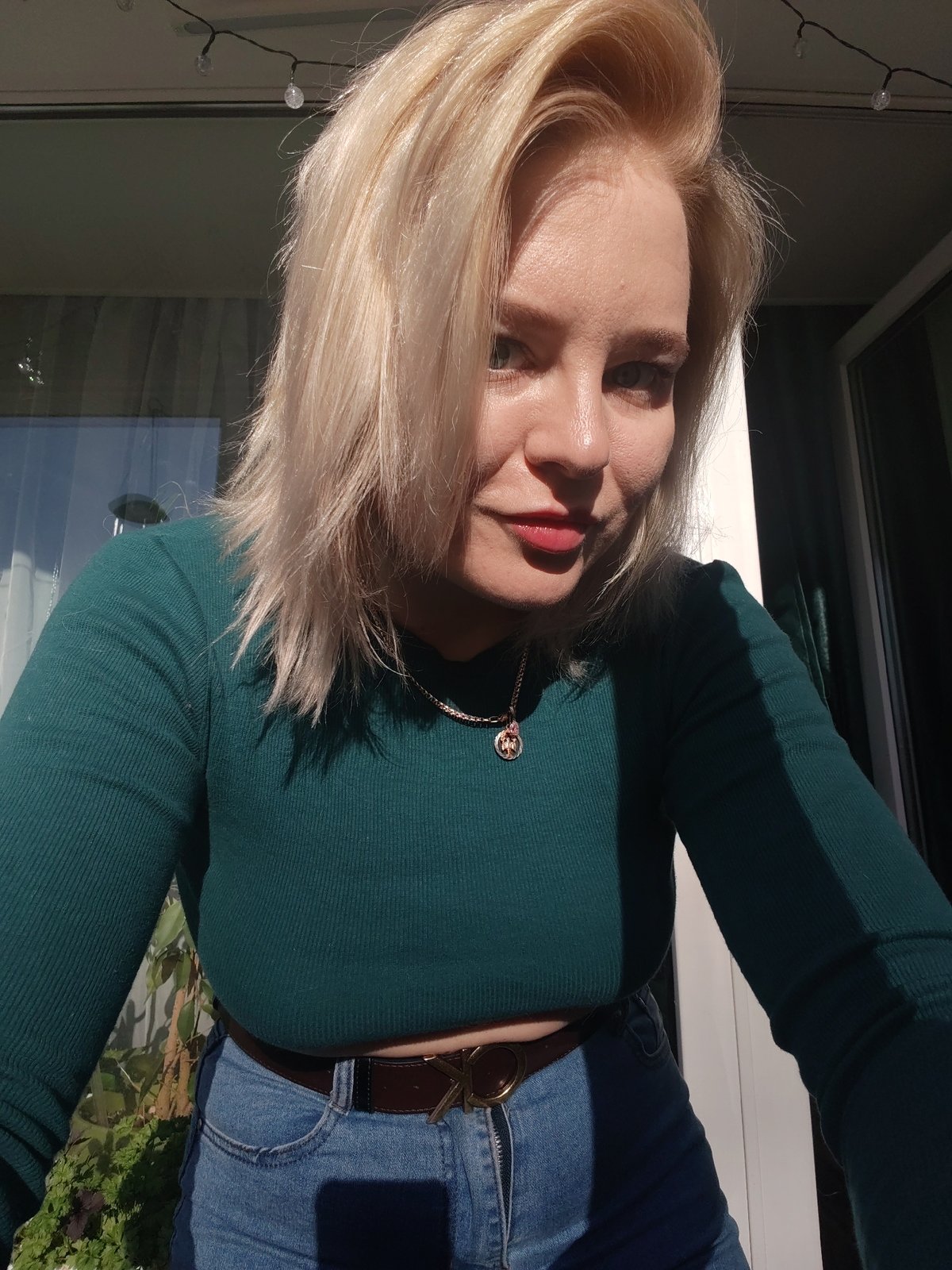 Blonde woman photographed in multiple outfits in Izhevsk