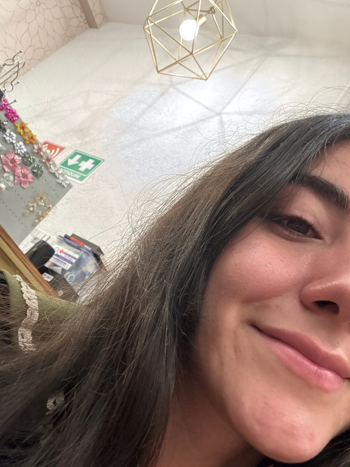 Woman takes selfies while shopping in Domingo Arenas boutique
