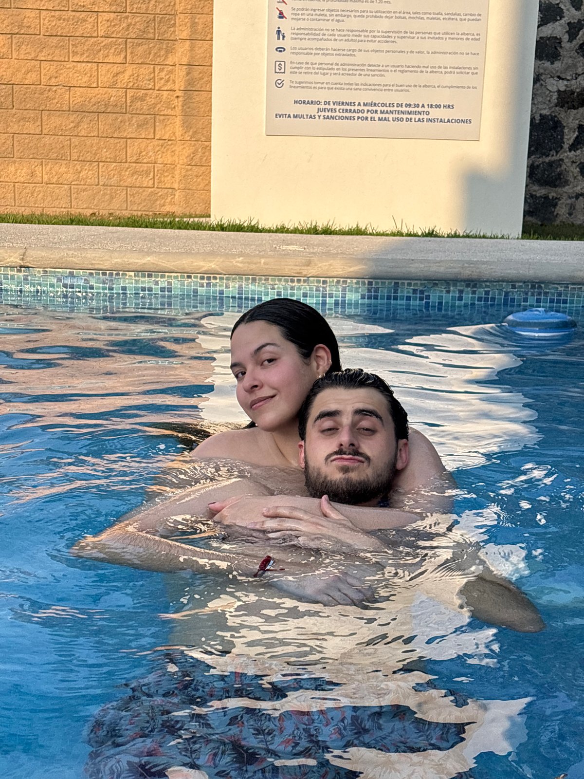 Couple enjoys late evening swim in Santa Clara Ocoyucan pool