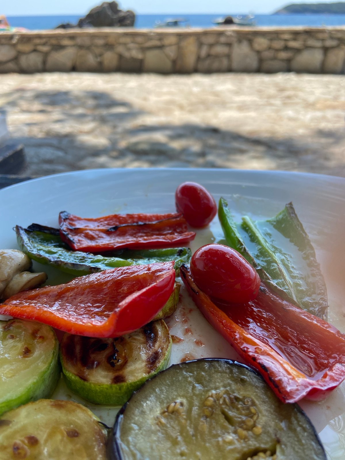 Rocky coastline hangout with grilled vegetables in Prijevor, Montenegro