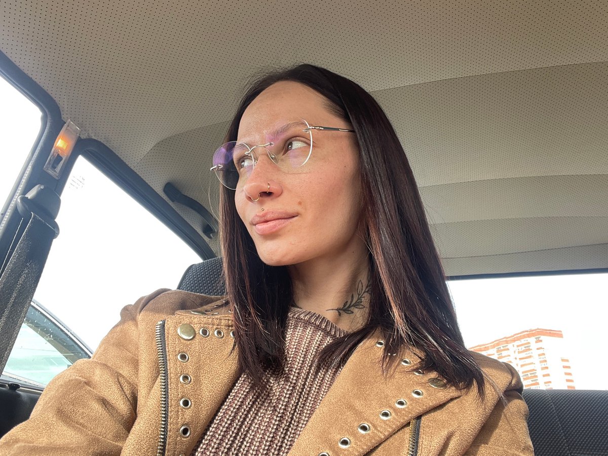 Woman with piercings photographed in car in Izhevsk