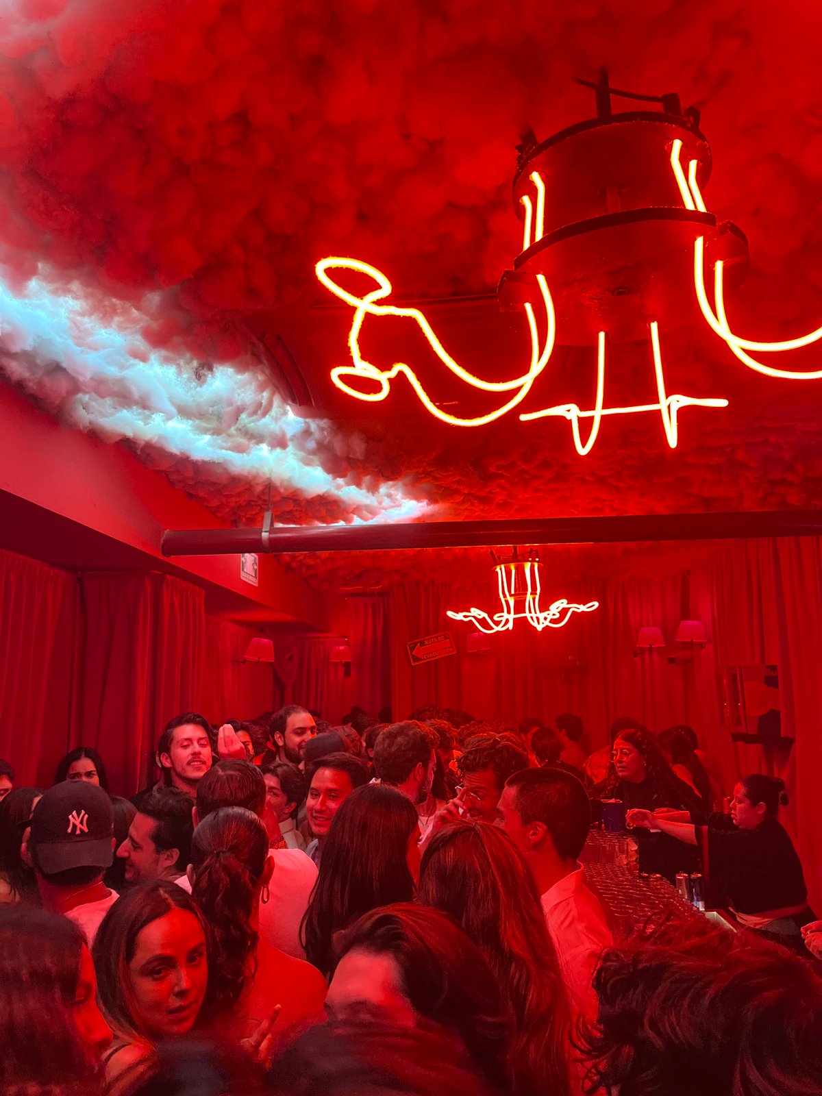 Morning scenes captured inside Mexican bar with red lighting