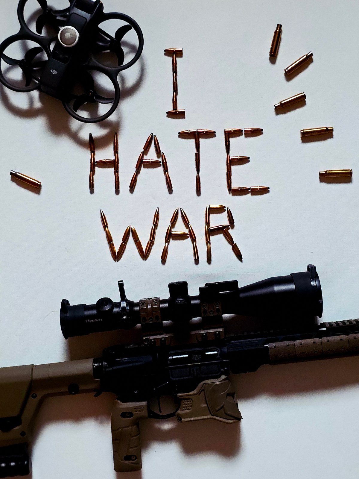 Anonymous photographer stages anti-war messages using firearms and ammunition