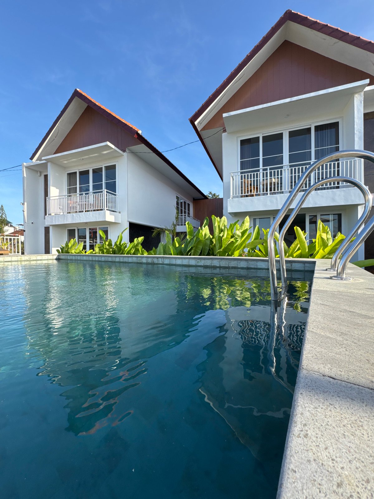 Bali resort morning: gardens, statues, and tropical sky