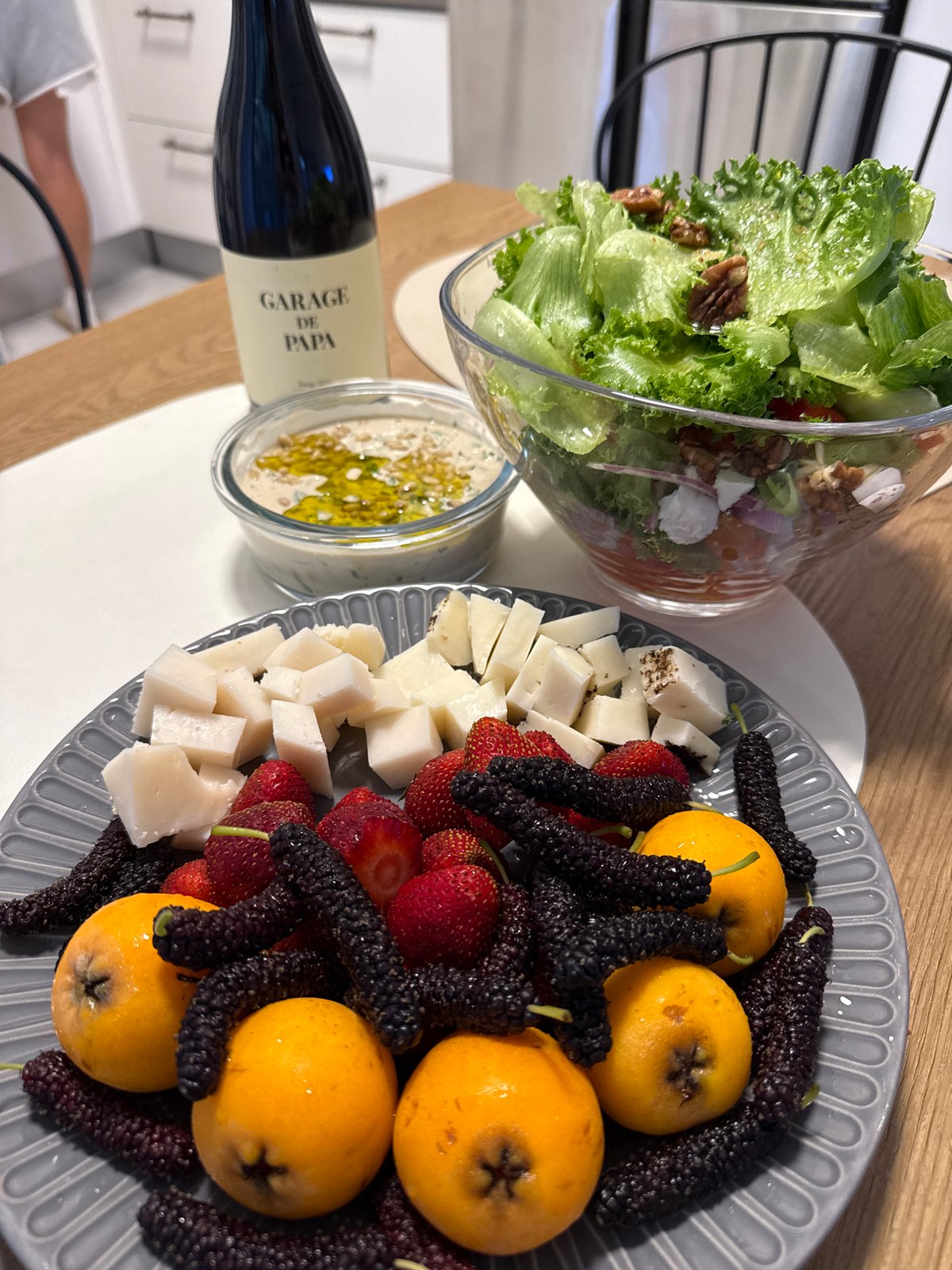 Wine and food arrangement documented in Herzliya dining setting