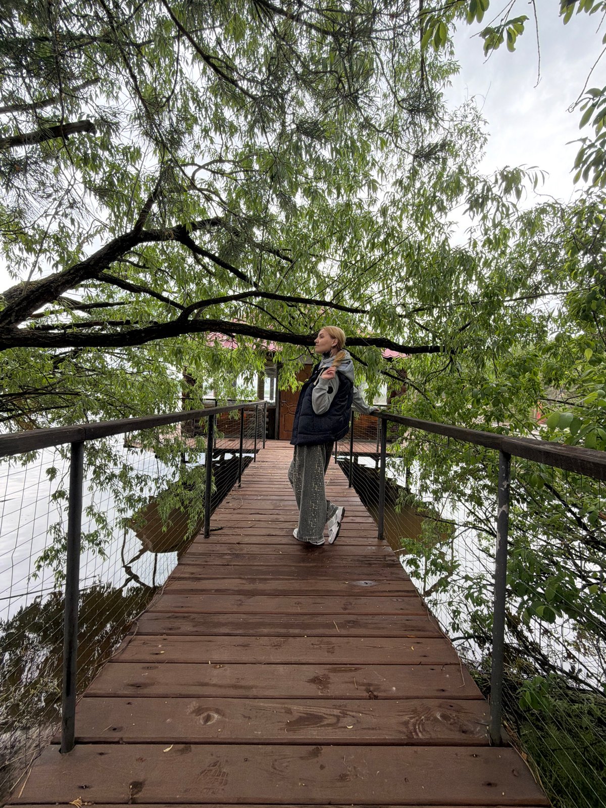 Woman visits lakeside recreational area in Chaykovsky, Russia