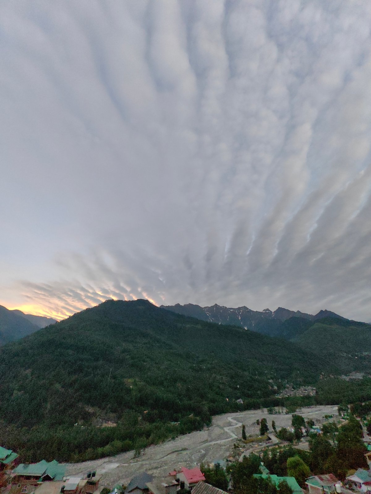 Dusk over Vashisht valley, Himalayas lit by dramatic cloud cover