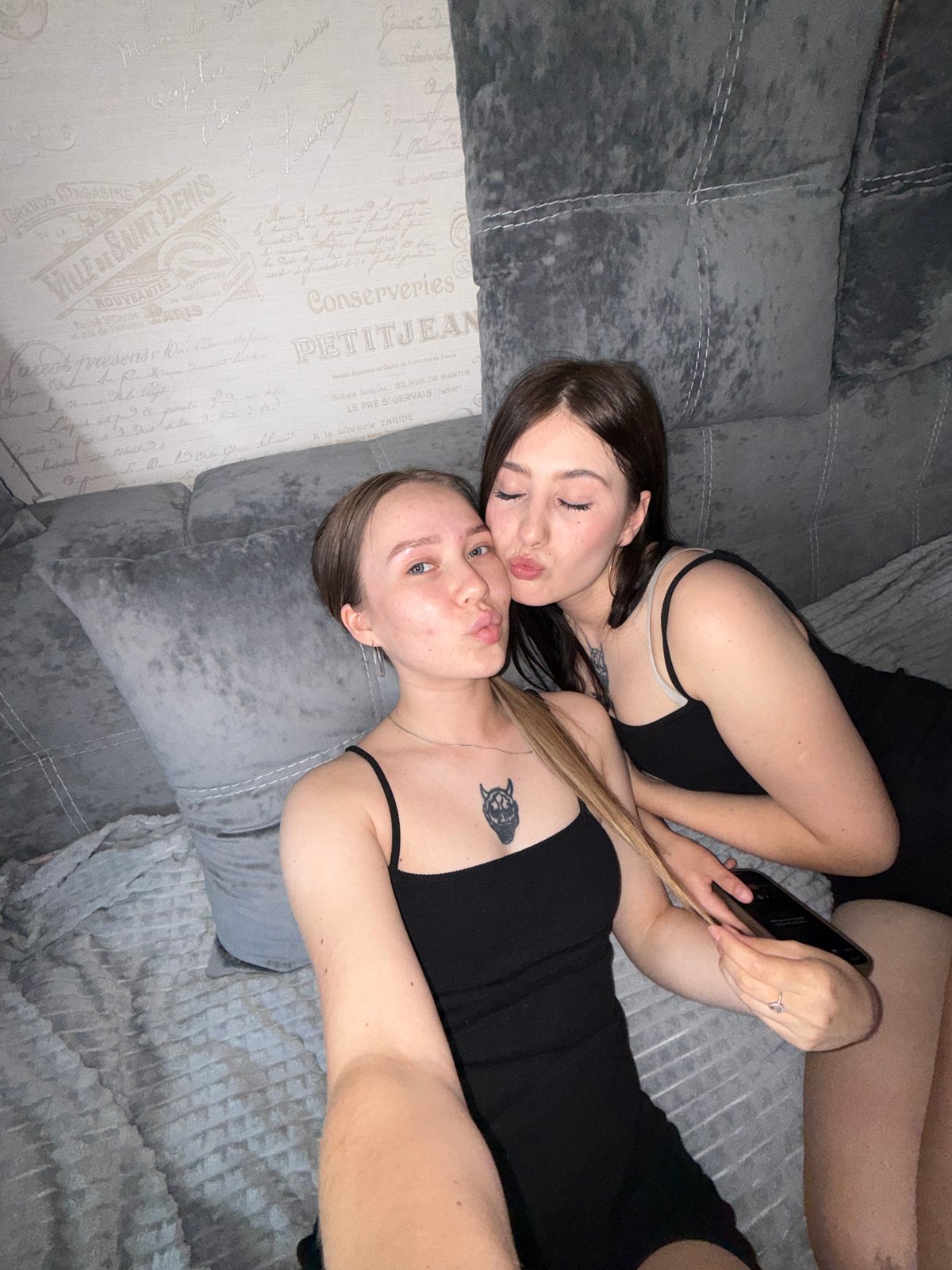 Two women photographed resting on couch in Chaikovsky bedroom