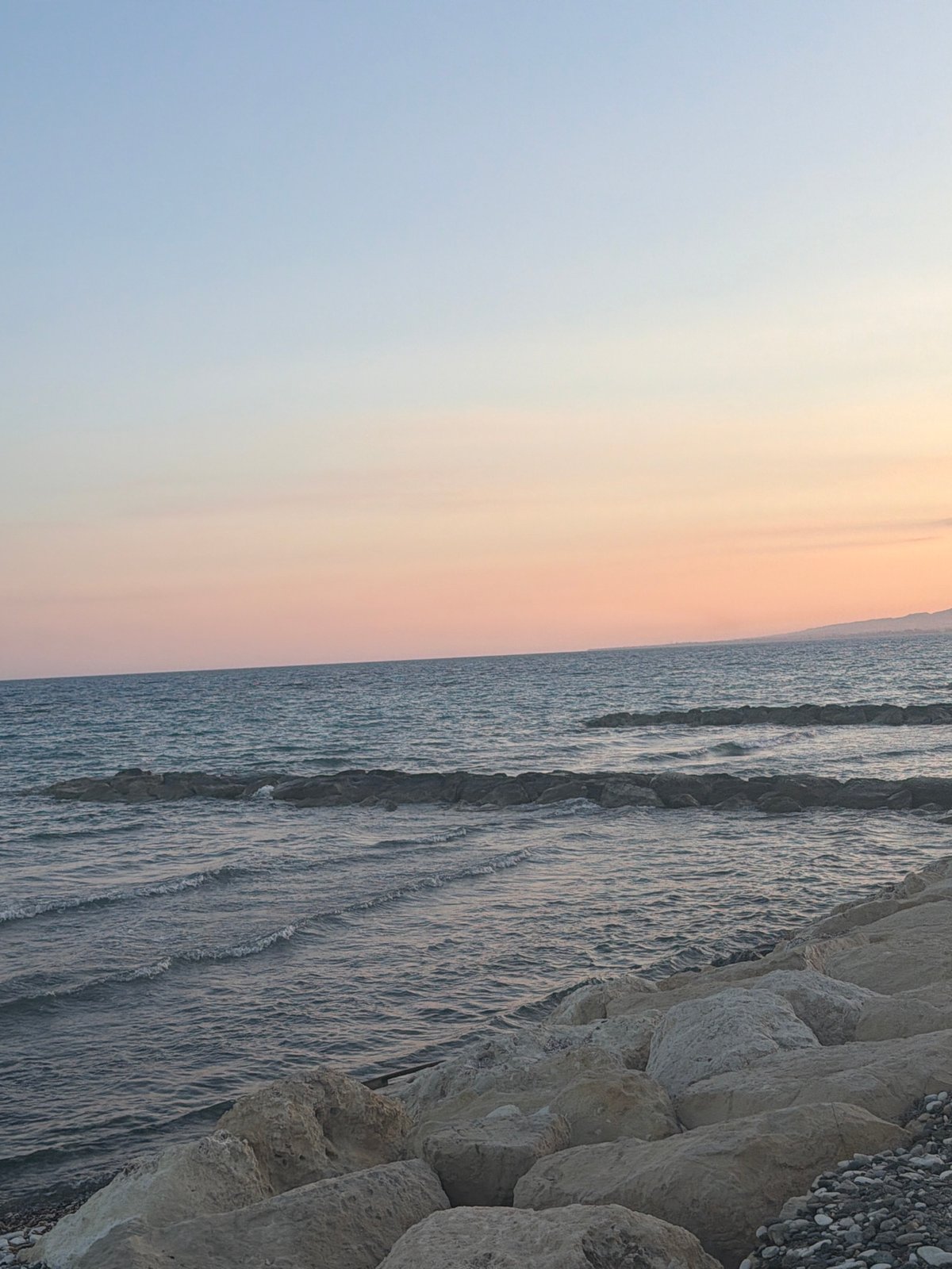 Sunset selfies and seascapes on a Pervolia pebble beach