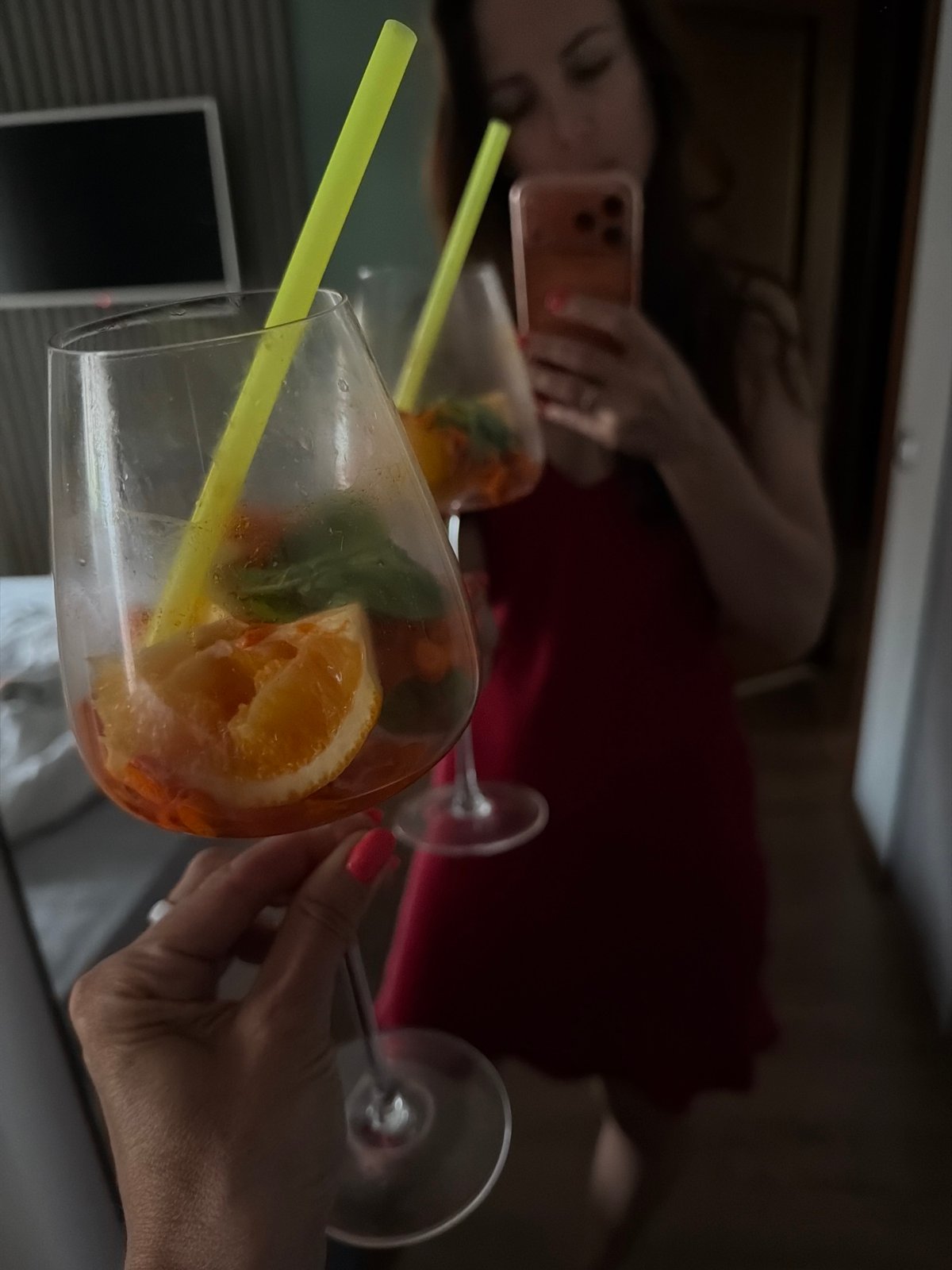 Person documents evening drink session in Birobidzhan apartment