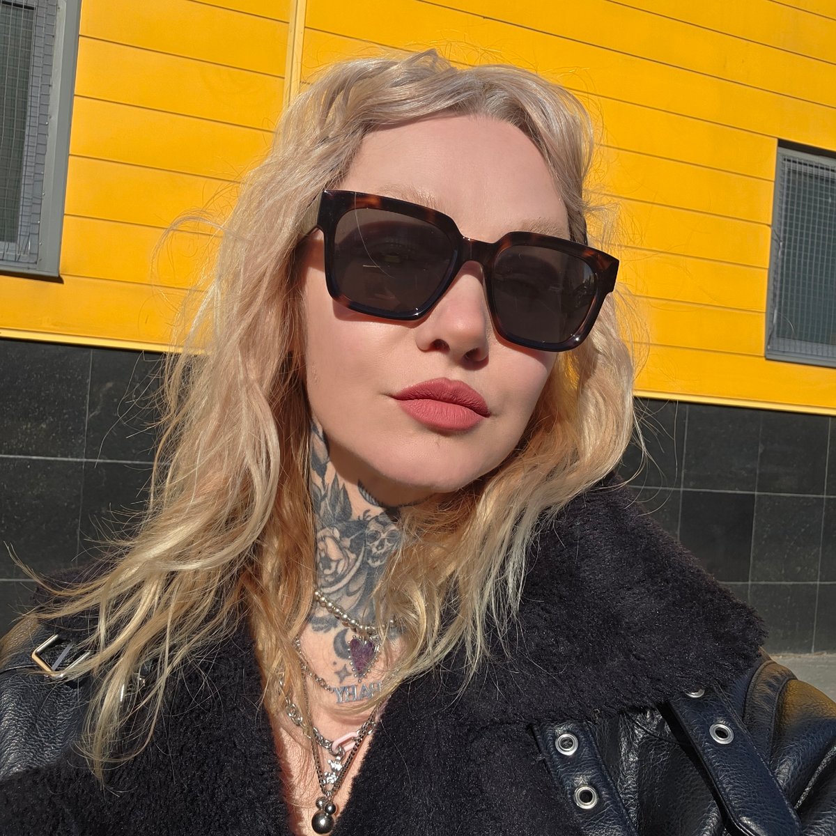 Woman takes selfies in Saint Petersburg pedestrian area