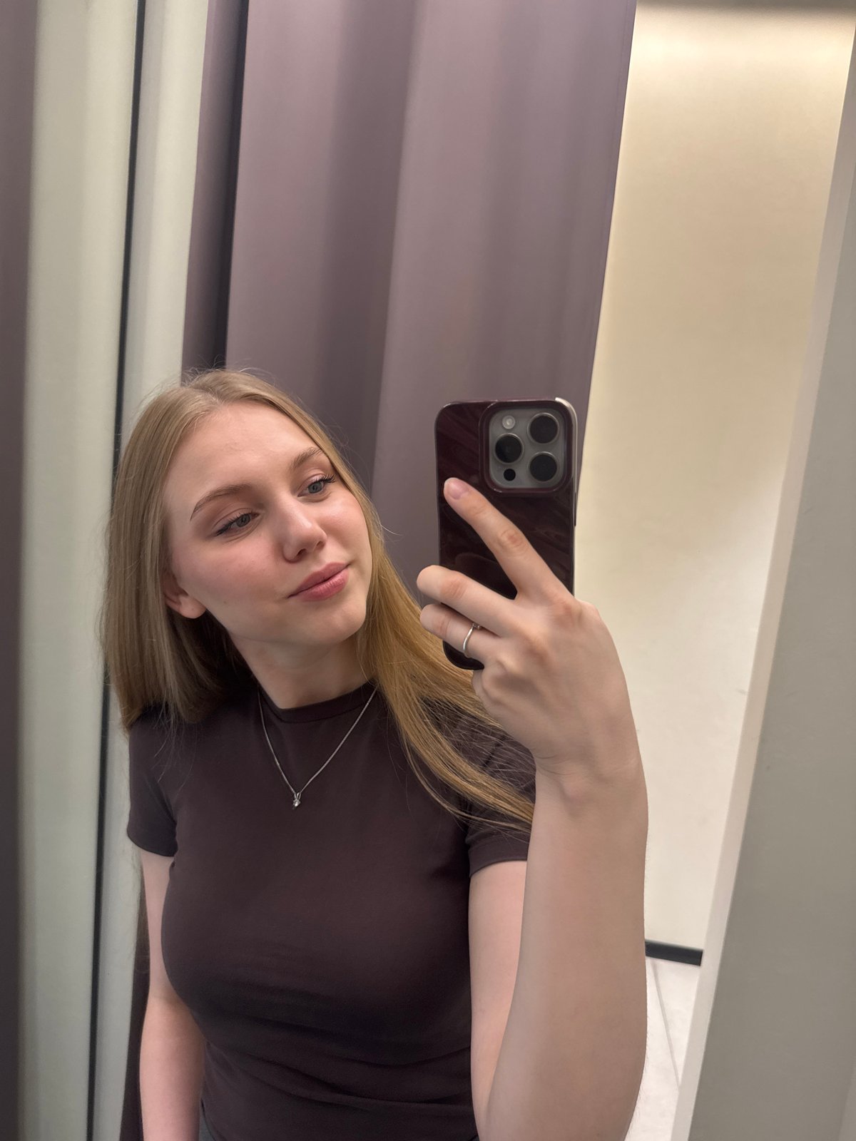 Young woman documents shopping trip through Perm, Russia stores