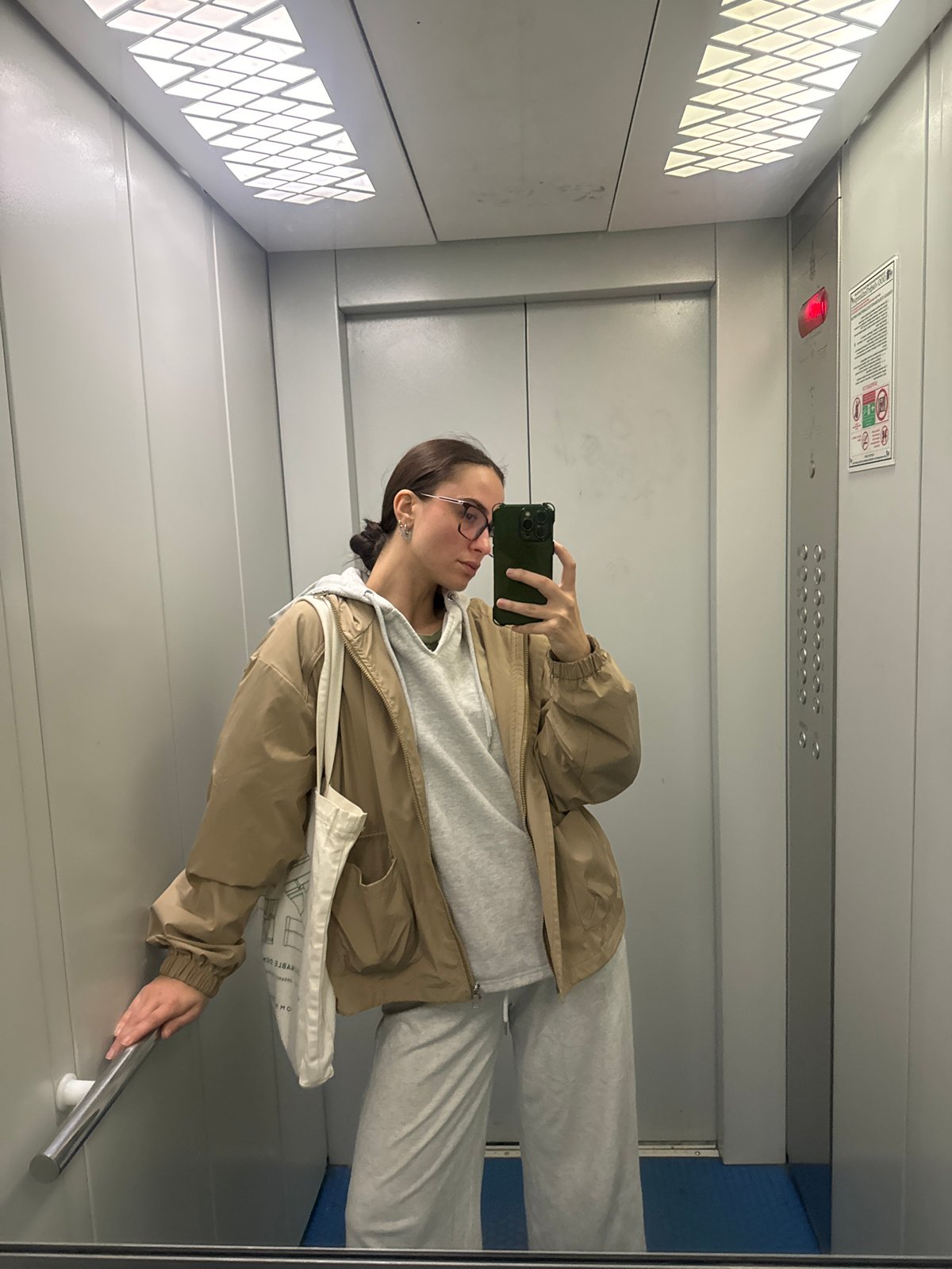 Woman takes elevator selfie in Krasnoyarsk mirror