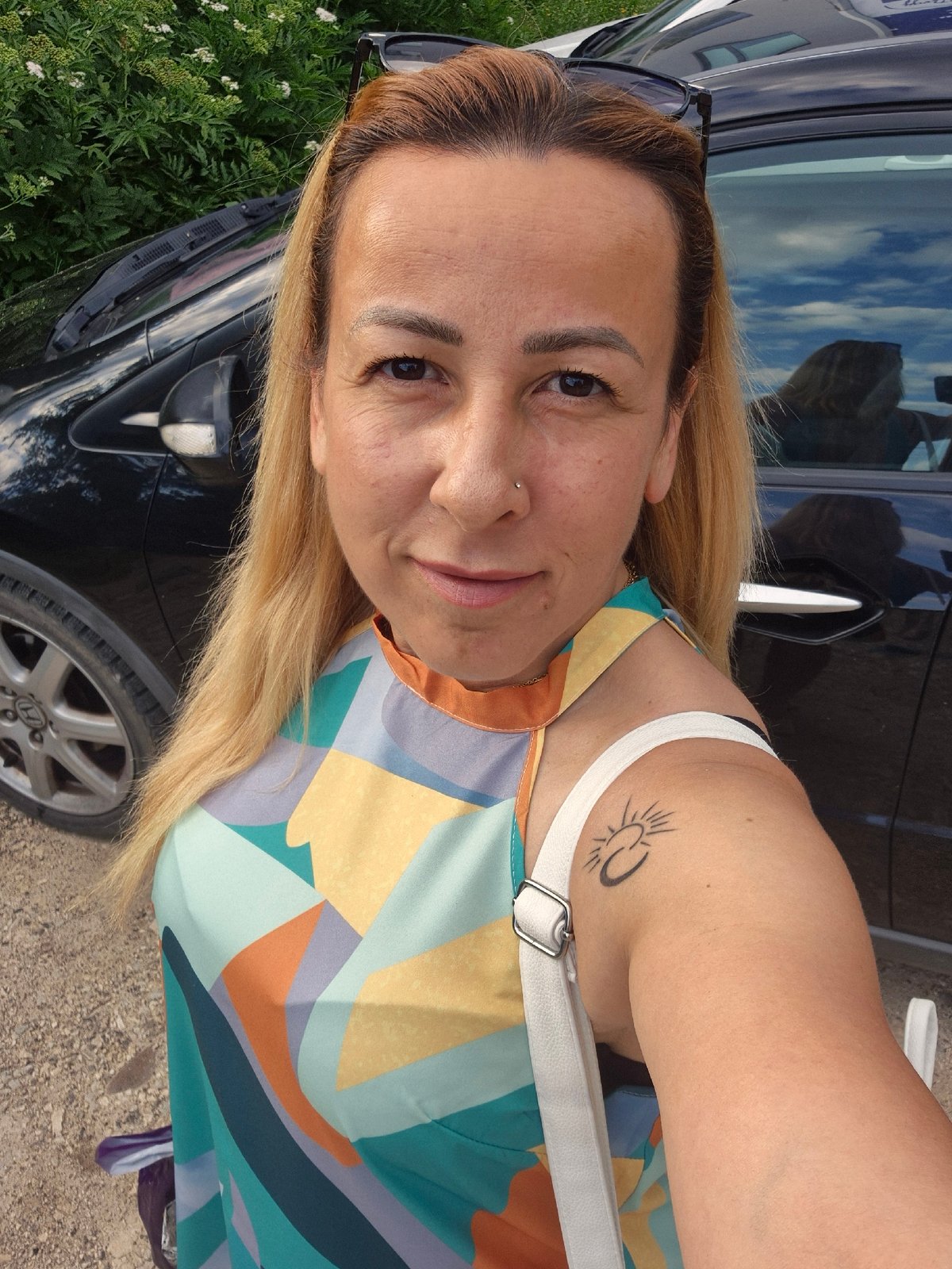 Selfie session in and around a car, colorful dress and greenery