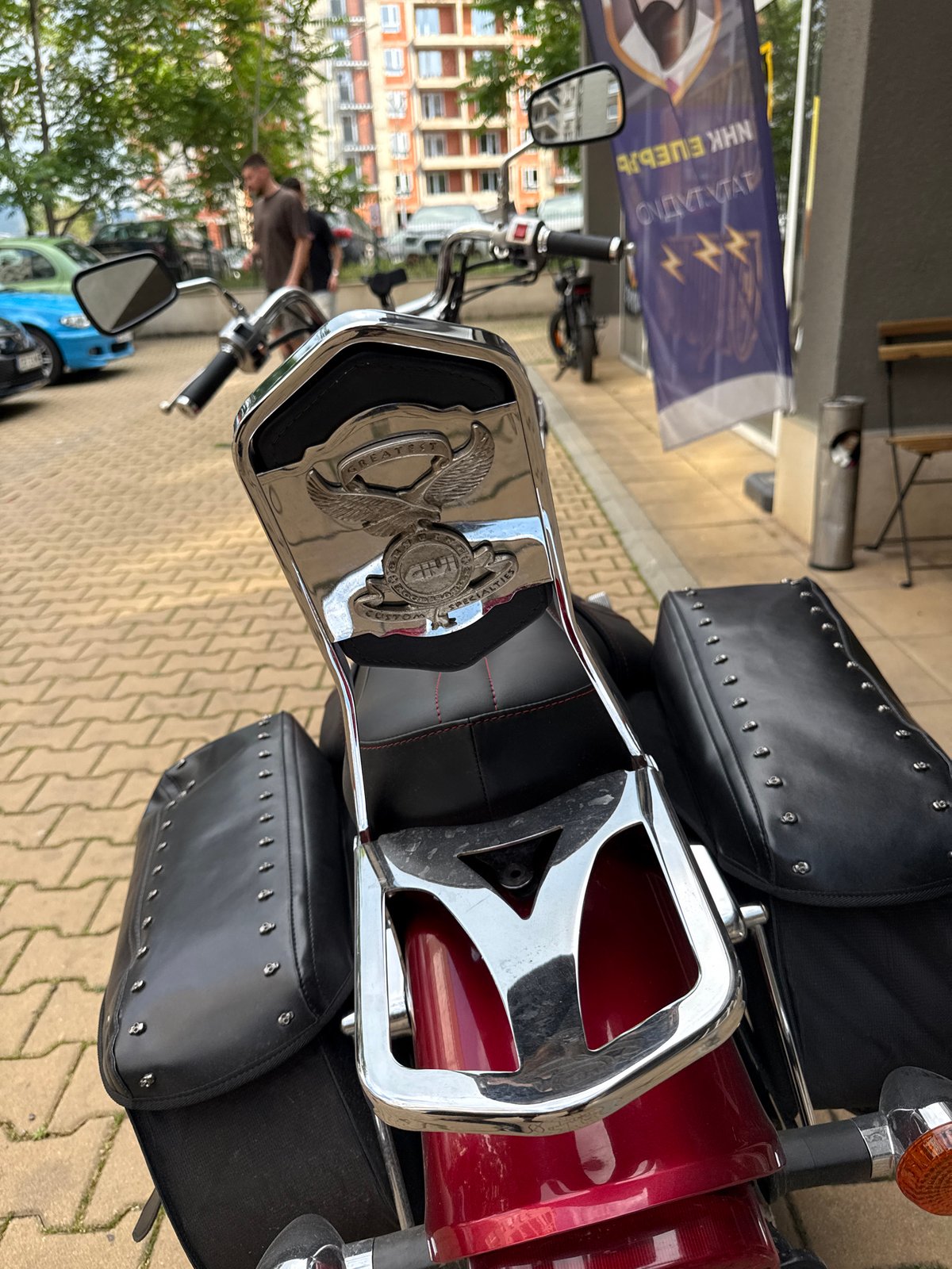 Red motorcycle and garden flowers documented in Sofia