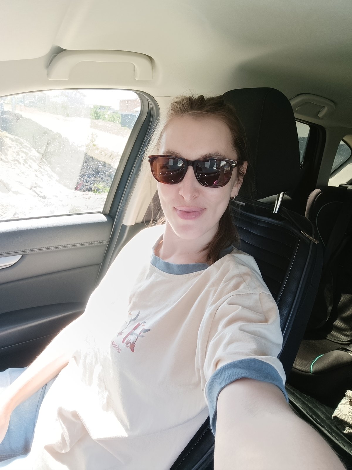 Everyday moments captured in Chaikovsky: woman in car, child eating