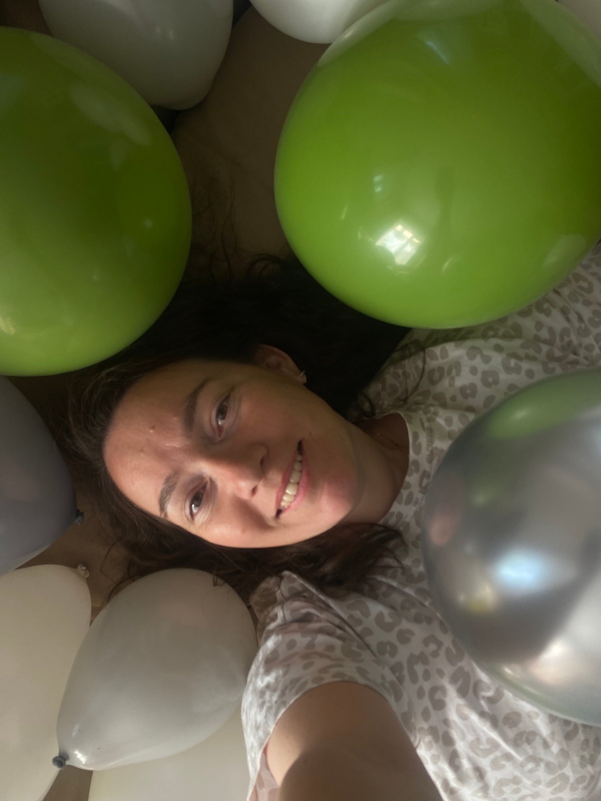 Woman surrounded by balloons in Russian town
