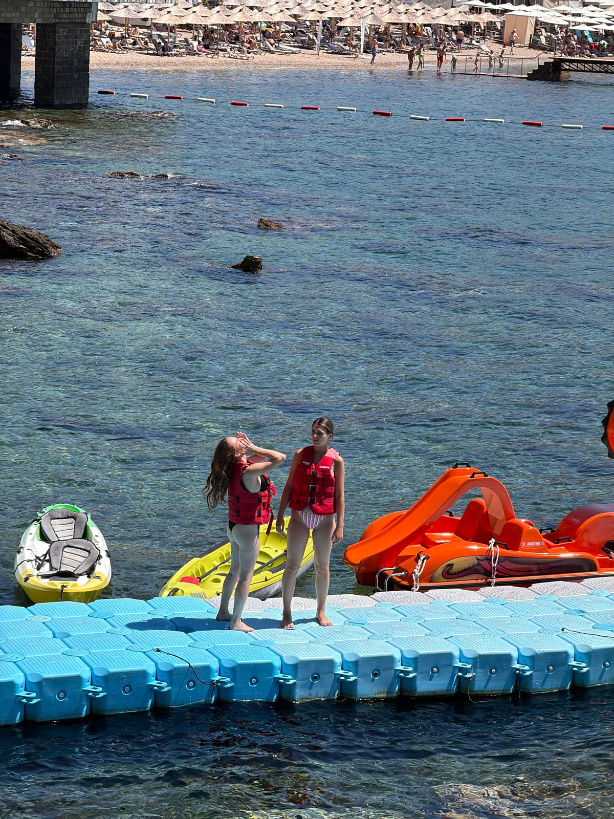 Summer beach day in full swing along Budva's Adriatic waterfront