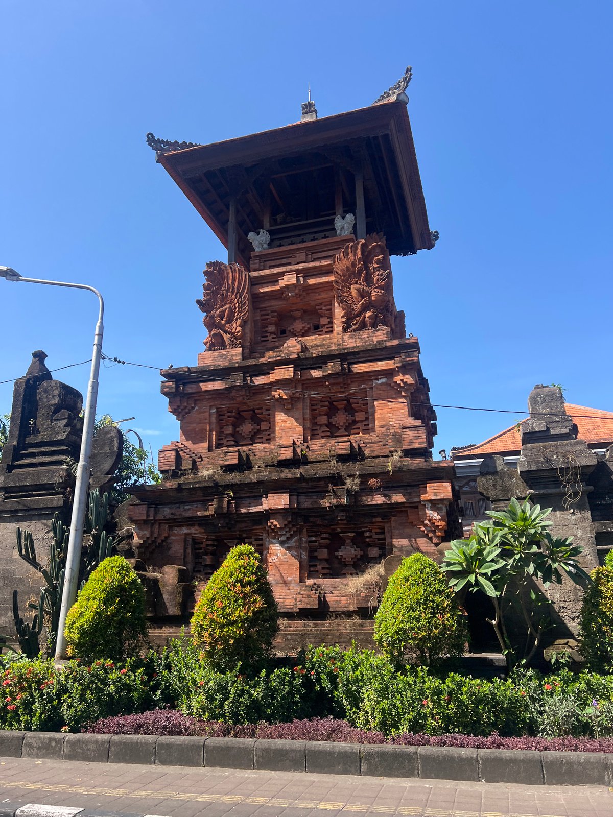 Balinese temple gate and bougainvillea in Denpasar