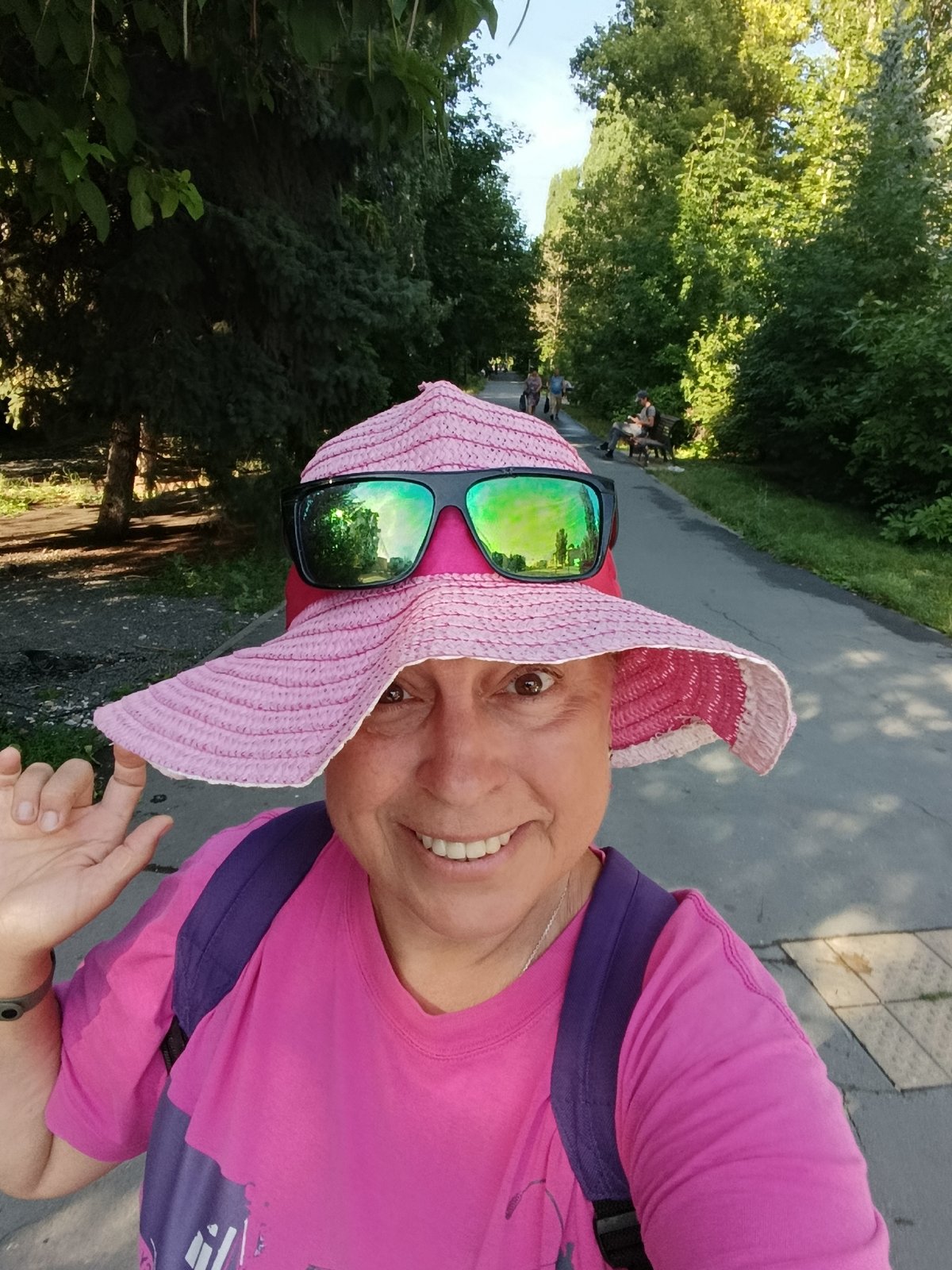 Selfie moment on a shaded park path in Saratov