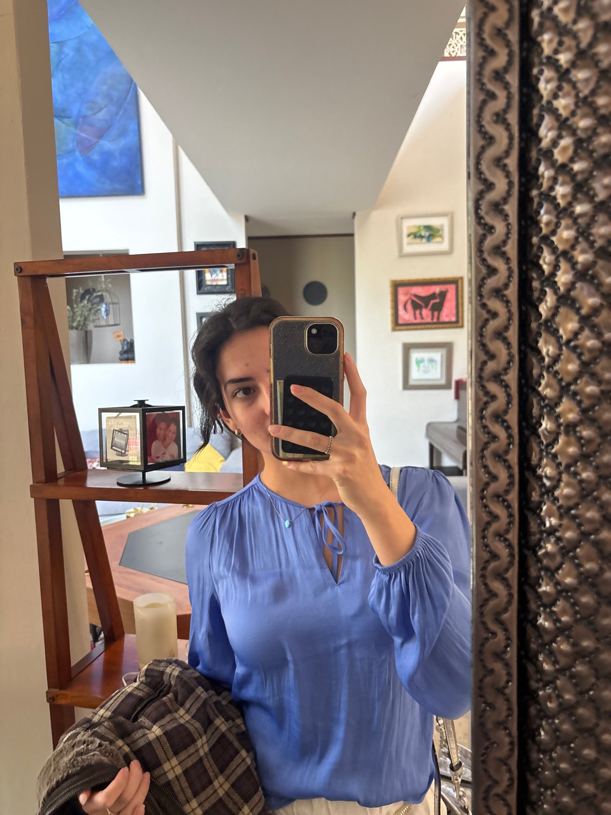 Woman takes mirror selfies, cleans mirrors in Puebla home