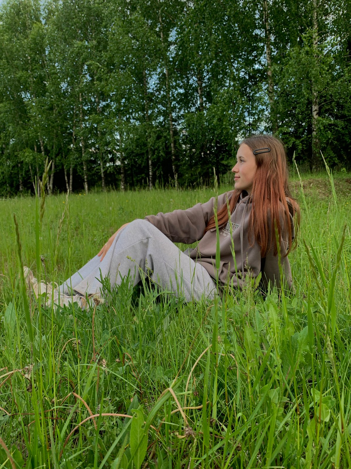 Two women enjoy playful afternoon in Russian countryside field