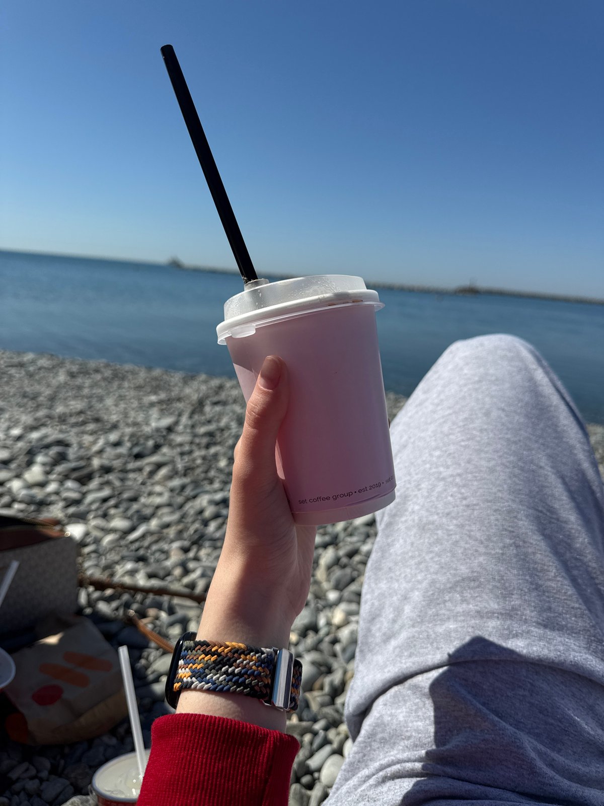 Morning coastal scenes capture casual moments at waterfront location