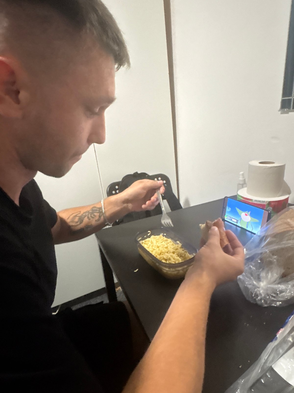 Late-night instant ramen with energy drinks on the side