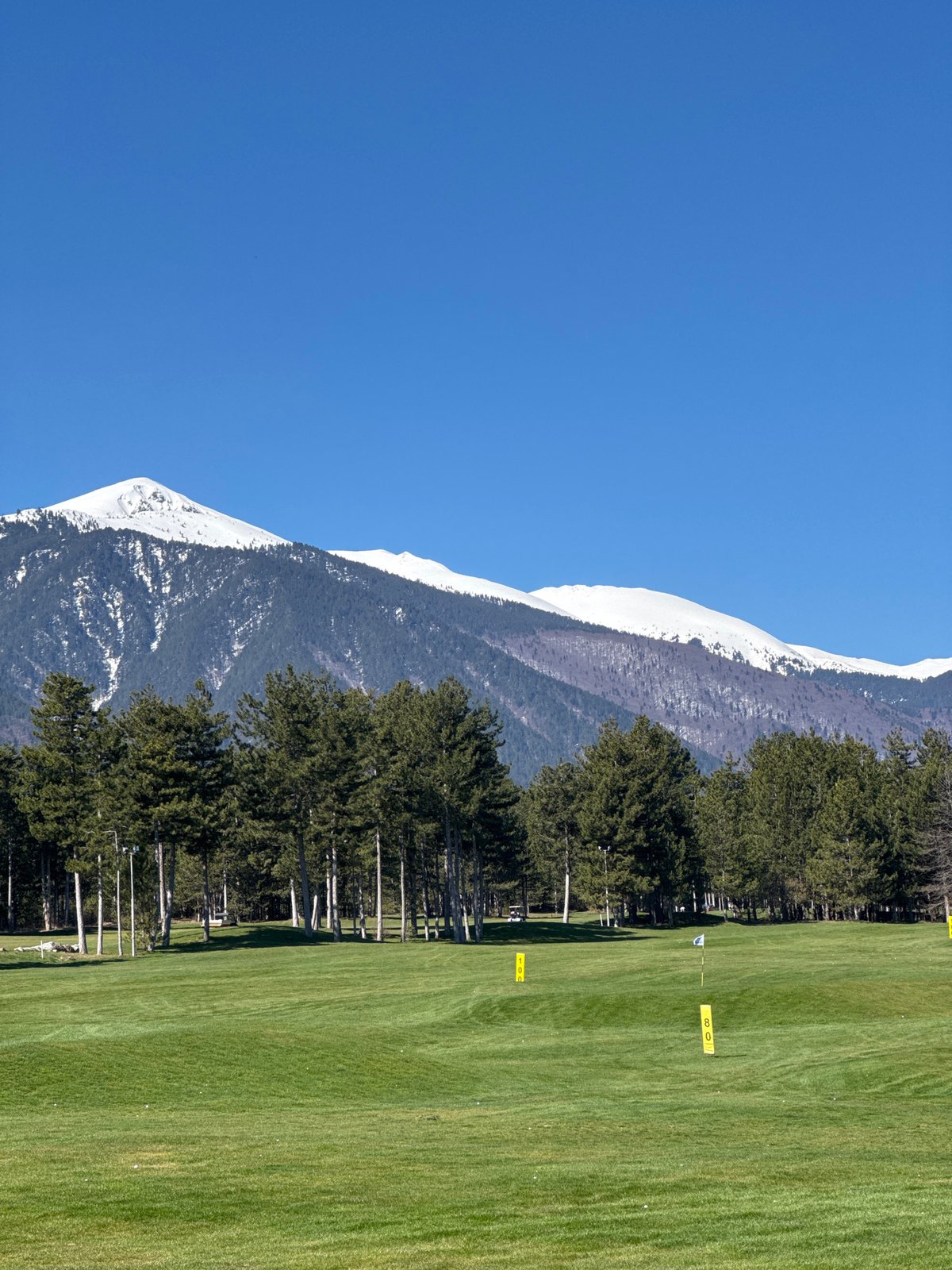 Golf course documented in Razlog, Bulgaria with mountain backdrop