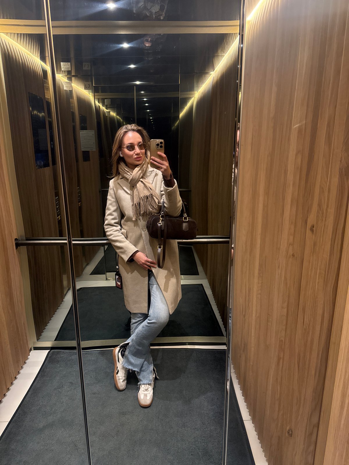 Woman takes elevator selfie in Riga, Latvia