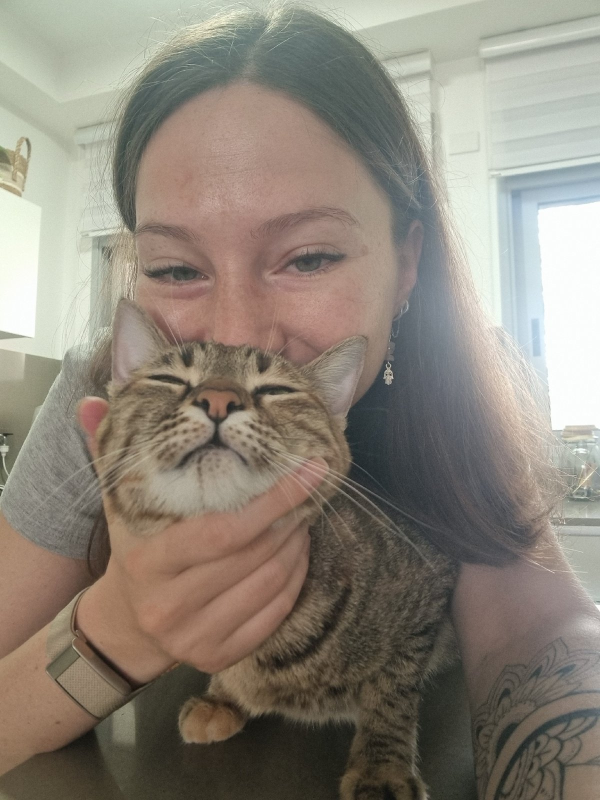 Woman shares affectionate moment with tabby cat in Ramat Gan