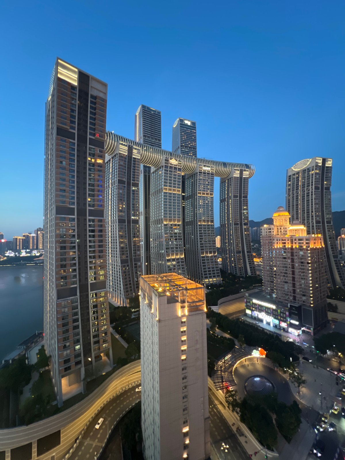 Chongqing's Yuzhong District skyline at dusk, multiple aerial angles
