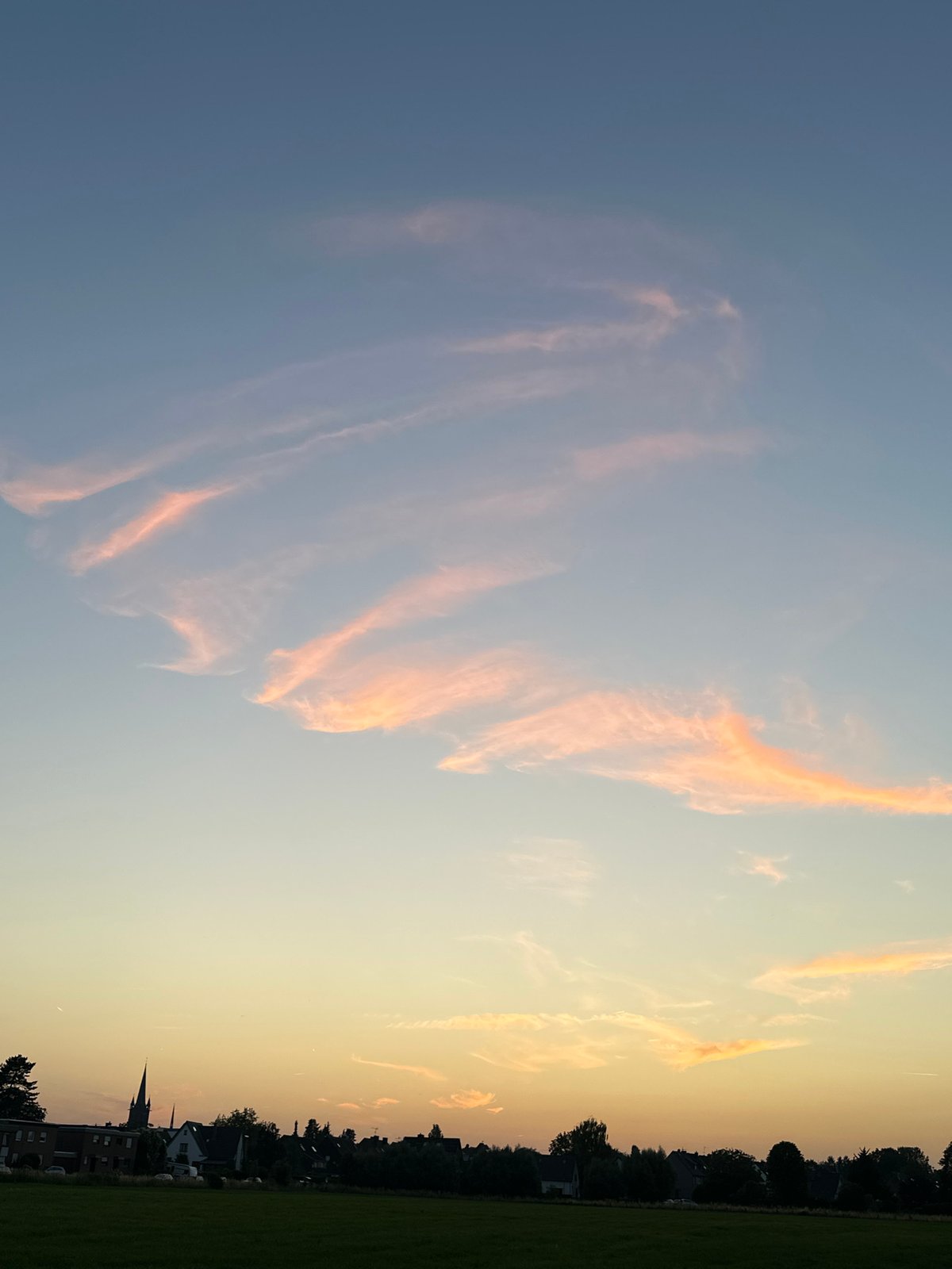 Sunset and moonrise at the rural edge of Krefeld