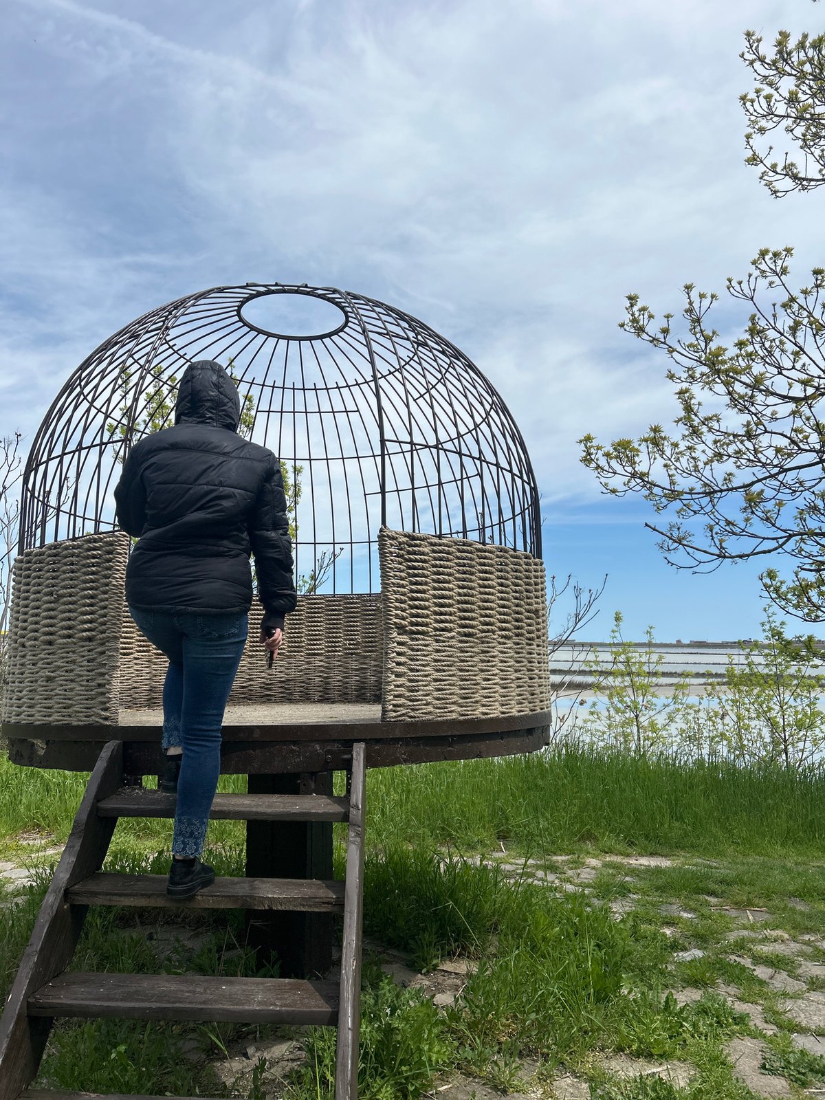 Visitor documents spherical art installation at Burgas waterfront